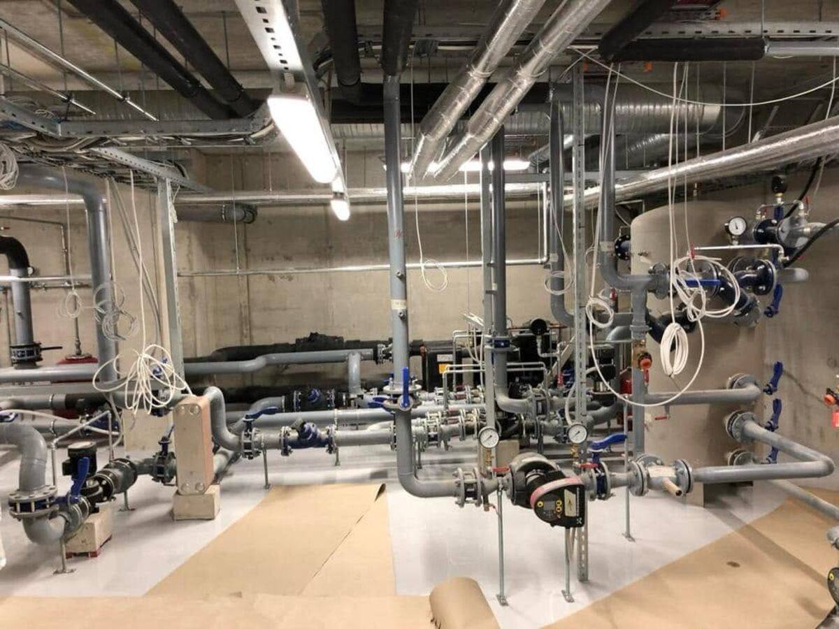 Boiler room with installed pipework and pumps