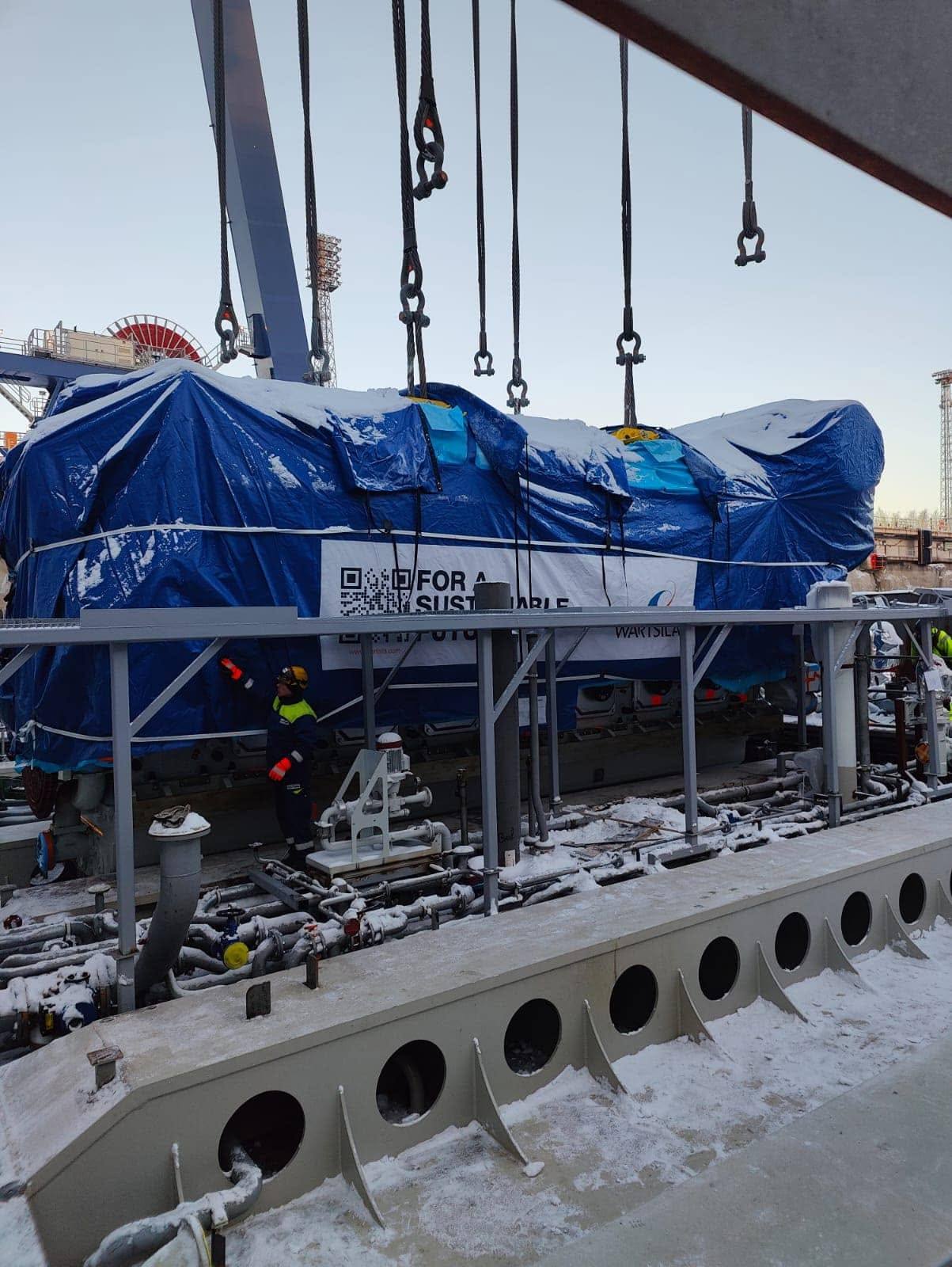 Machinery module under snow before lifting